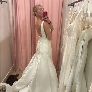 Elegant Ivory Satin Backless Wedding Dress with Buttoned Train